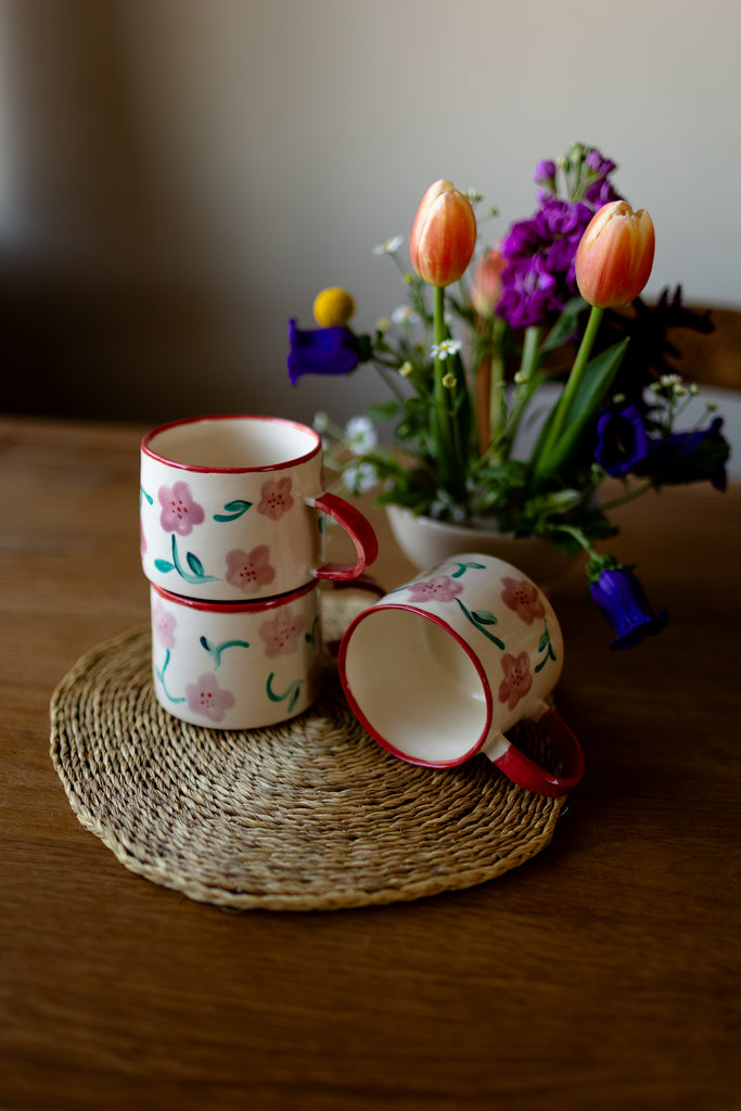 Hand-painted ceramic mug with pink and red blossom design, 10x9cm, for coffee or tea.