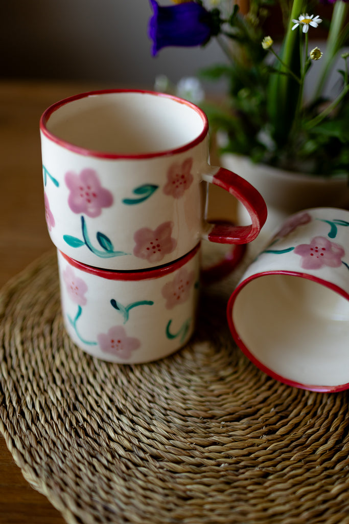 Hand-painted ceramic mug with pink and red blossom design, 10x9cm, for coffee or tea.