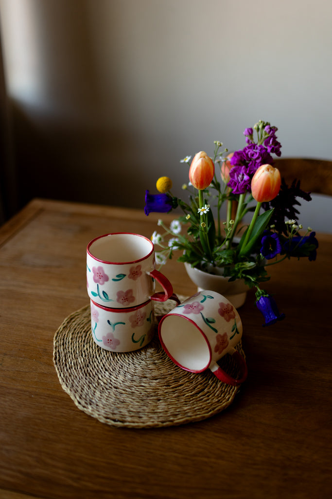 Hand-painted ceramic mug with pink and red blossom design, 10x9cm, for coffee or tea.