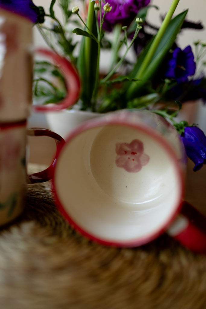 Hand-painted ceramic mug with pink and red blossom design, 10x9cm, for coffee or tea.