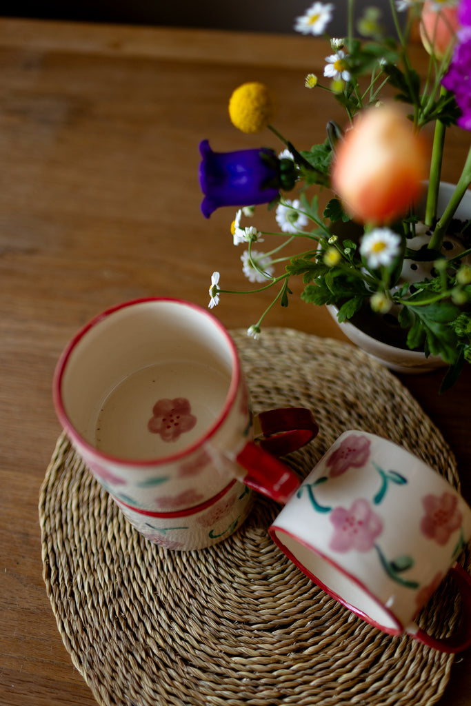 Hand-painted ceramic mug with pink and red blossom design, 10x9cm, for coffee or tea.