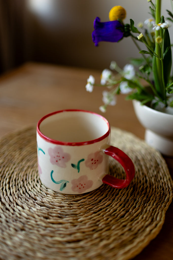 Hand-painted ceramic mug with pink and red blossom design, 10x9cm, for coffee or tea.