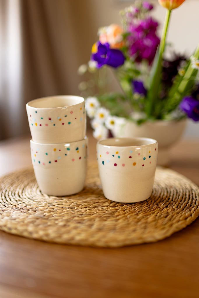 Small speckled ceramic espresso mugs in a creamy glaze, handmade stoneware.