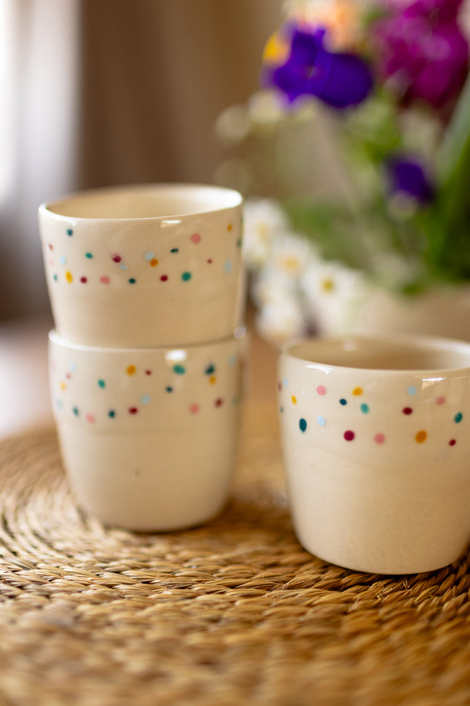 Small speckled ceramic espresso mugs in a creamy glaze, handmade stoneware.