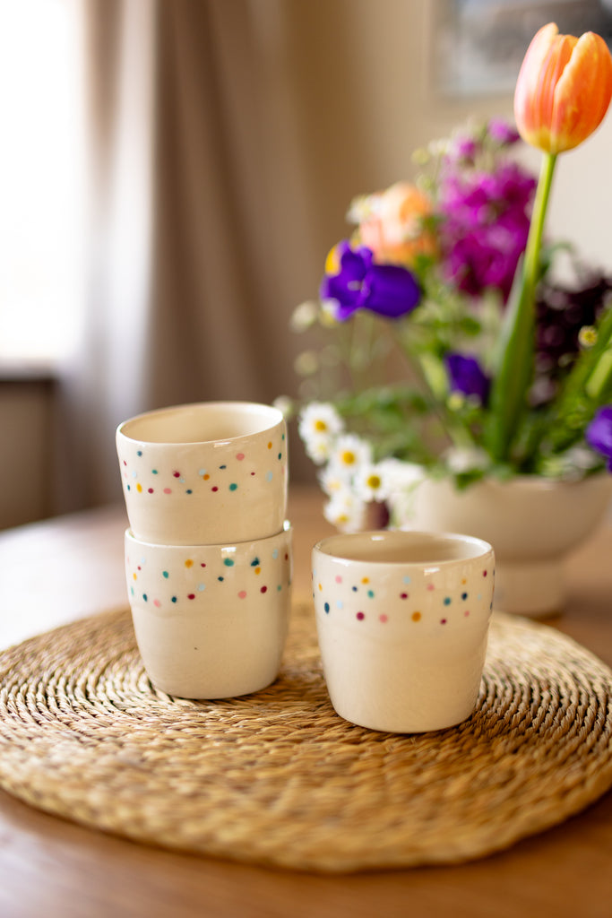 Small speckled ceramic espresso mugs in a creamy glaze, handmade stoneware.
