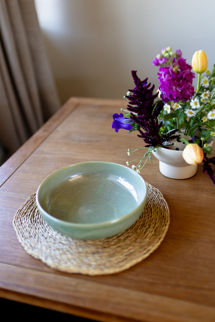  Rustic handmade ceramic pasta bowl in moss green glaze, perfect for serving pasta or salads.