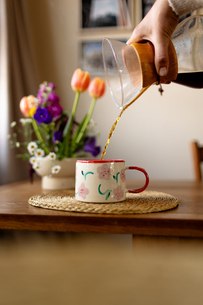 Hand-painted ceramic mug with pink and red blossom design, 10x9cm, for coffee or tea.